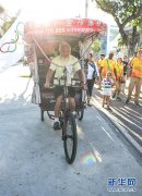  中国农民“骑”到巴西追逐奥运 
